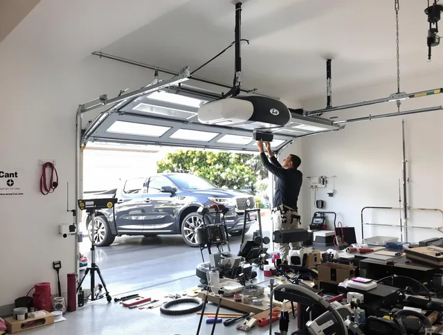 New Franklin Garage Door Repair specialist installing smart garage door opener system in New Franklin home