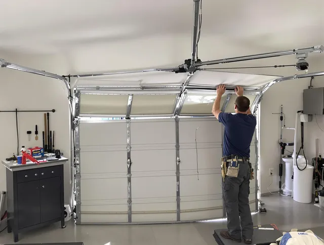New Franklin Garage Door Repair specialist performing precise section replacement on New Franklin garage door